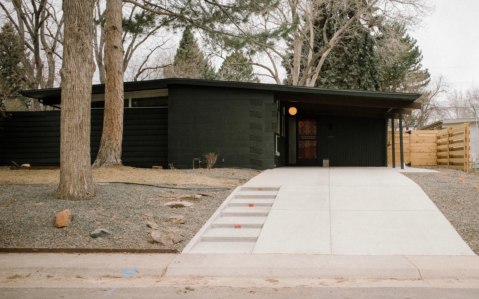 After: mid-century Boulder home repainted a bold charcoal by JEI Painting