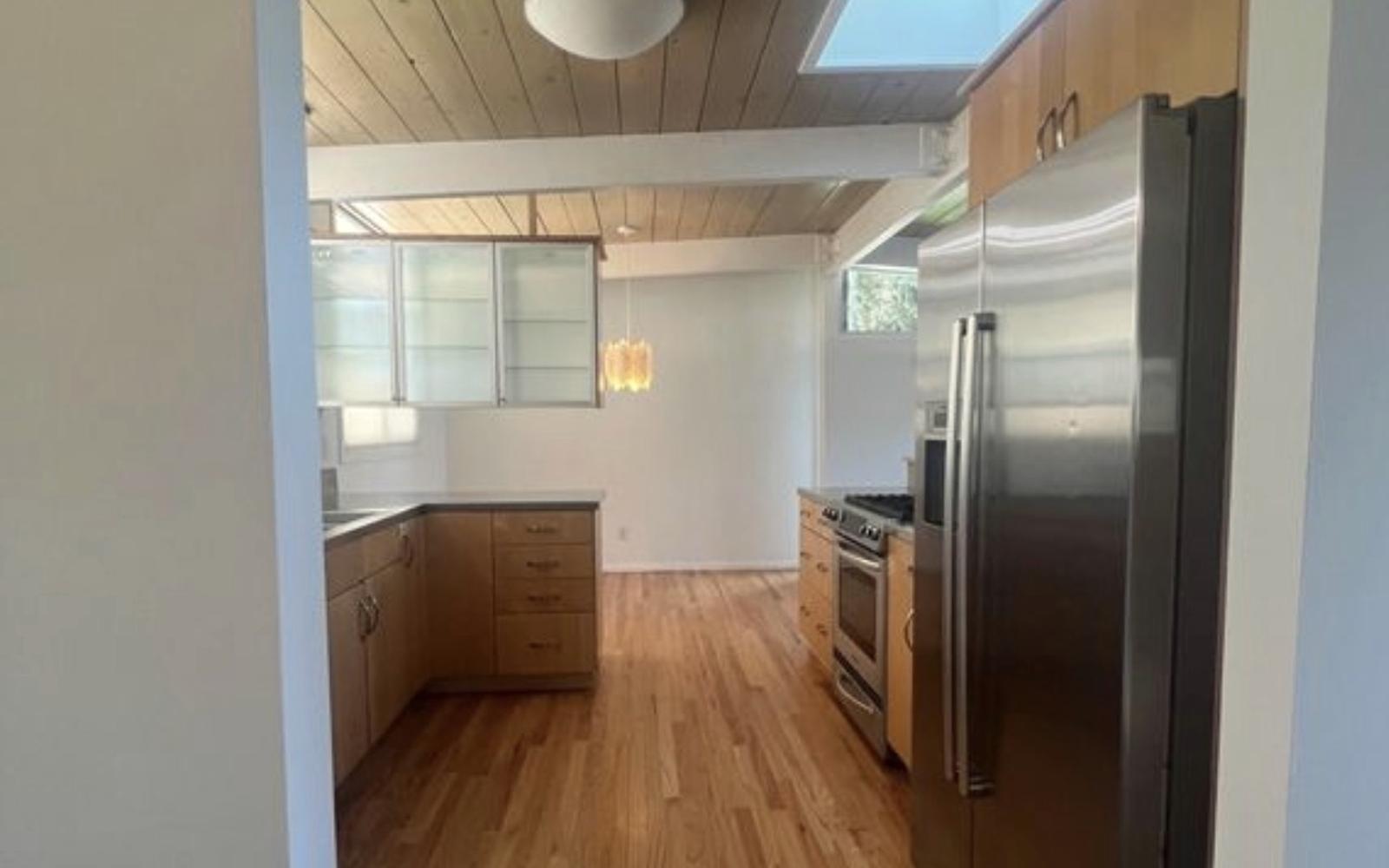 Before: the kitchen with dated wood cabinets