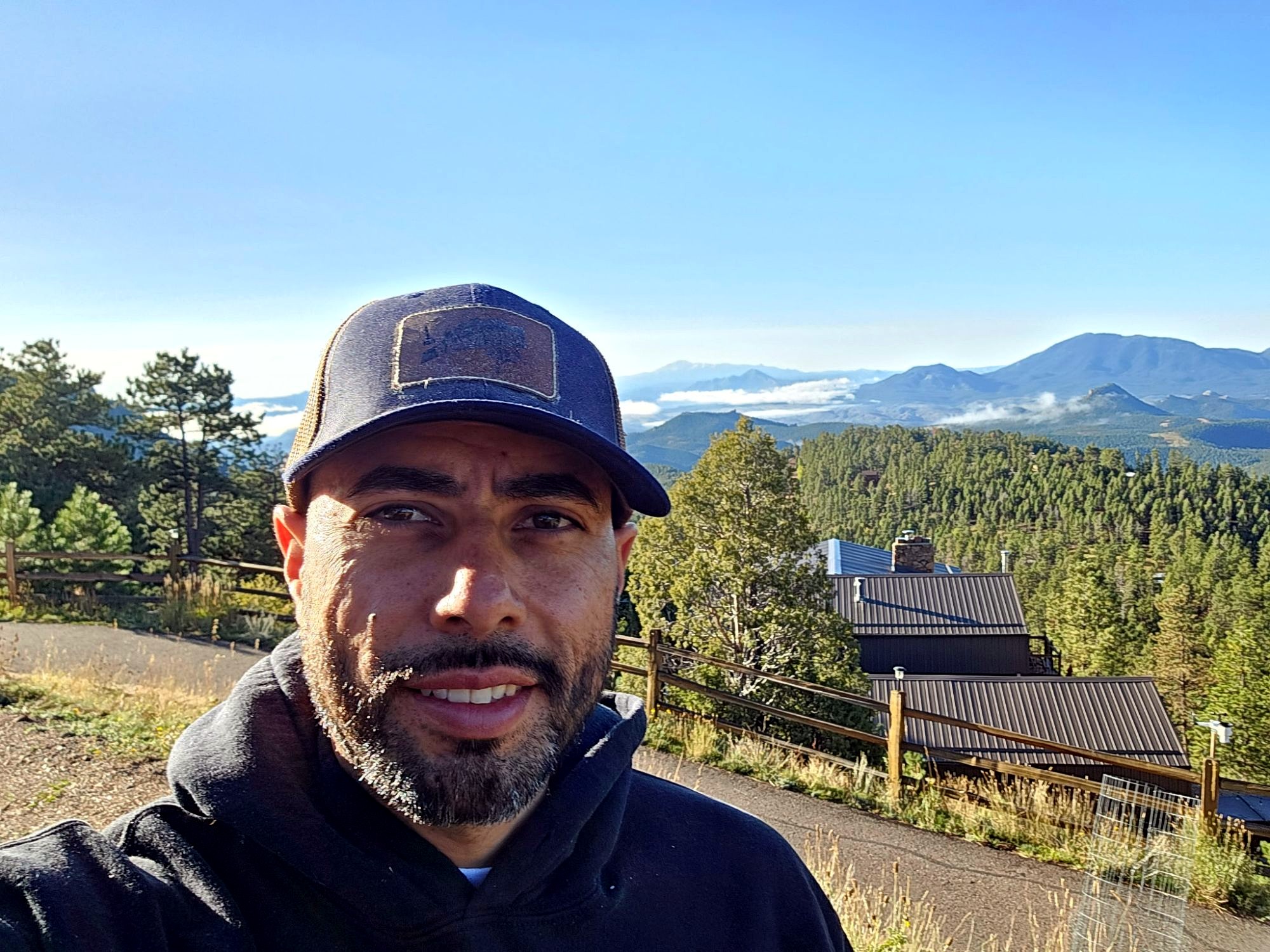 Luis, founder of JEI Painting, in the Colorado mountains