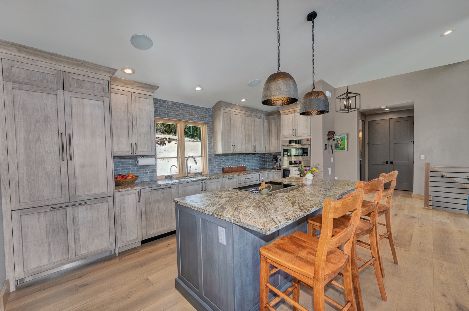 Modern gray kitchen with granite island, finished by JEI Painting